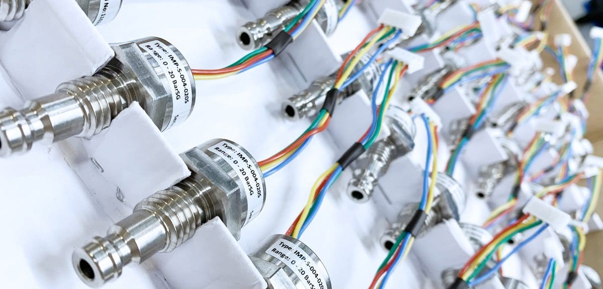 Rack of finished cable assemblies with sensors