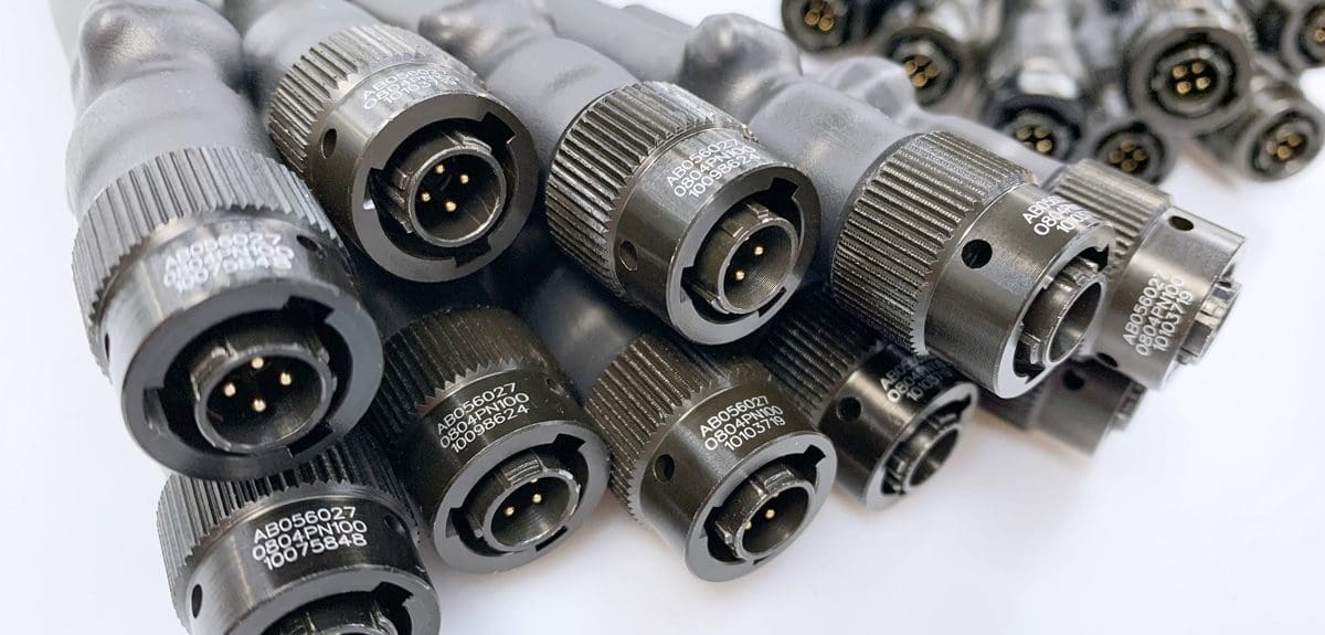 A group of military and defence grade cable assemblies. Showing the metal robust connectors.